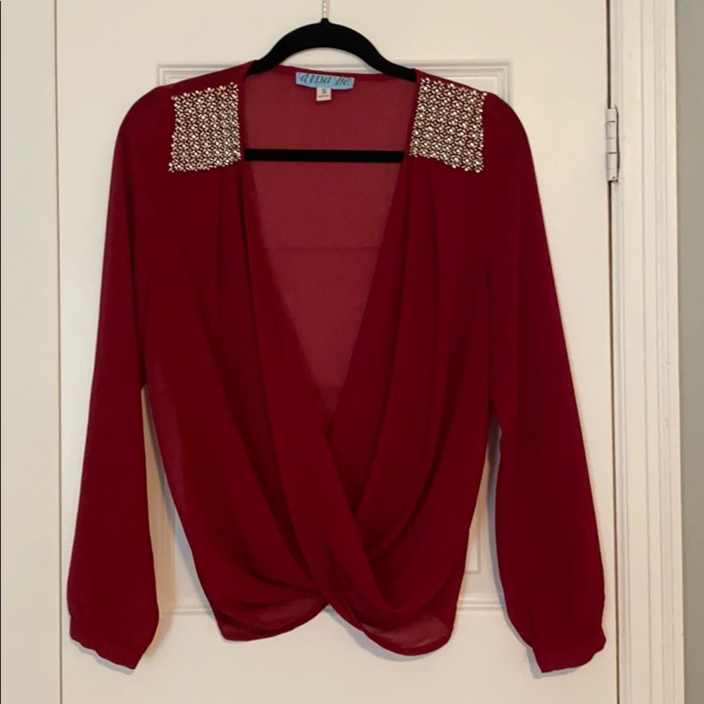 Red/maroon blouse with twist bottom